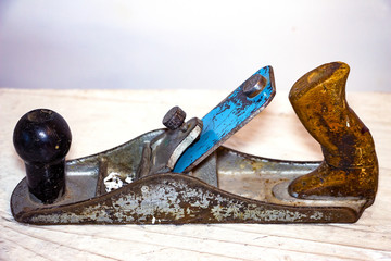 A carpenter's tool. Old planer on a natural background