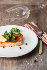 grilled salmon with cherry tomatoes and salad