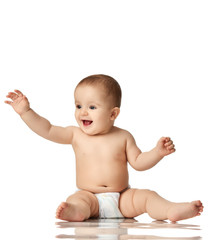 8 month infant child baby boy kid toddler sitting in diaper thinking happy laughing isolated on a white