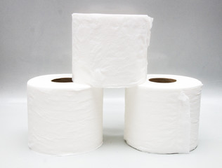 Three stacks of toilet paper