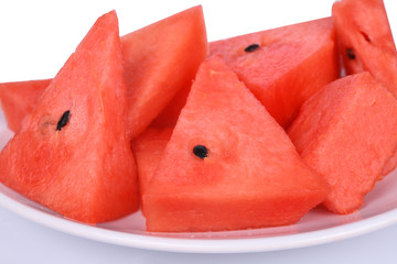 Sliced ripe watermelon isolated on white plate