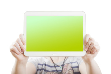hands holding pc tablet isolated on green