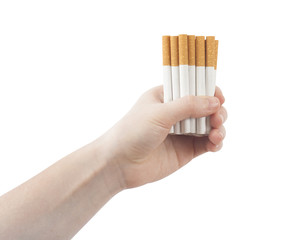 hand holding pile of cigarettes isolated on white