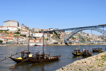 Obraz premium Wine transport boats in Portugal. These boats transport the barrels of wine from the interior of the country to Vila Nova de Gaia and Porto.