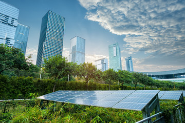 solar panel plant with urban landscape landmarks,Ecological energy renewable concept.