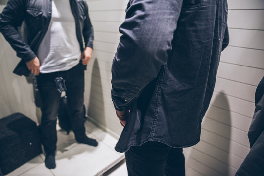 Adult Man In Changing Room In Store. Fashion Clothing Shopping