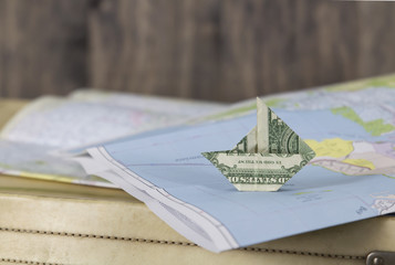 Paper Money Sailboat on a Map
