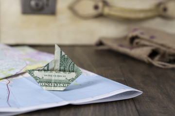 Paper Money Sailboat on a Map