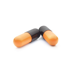 Two pills close up view against white background