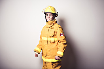 Picture from a young firefighter on studio white wall