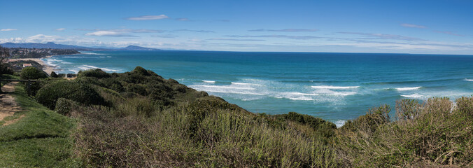 Fototapeta premium panoramic scenic atlantic coastline in sunny blue sky in bidart, basque country, france