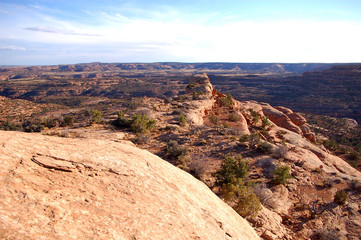 Vista of canyons, red rock cliffs and sky in Bears Ears Wilderness of Southern Utah
