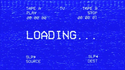 An old damaged VHS tape tracking a bad signal coming from a double deck, with the text Loading.
