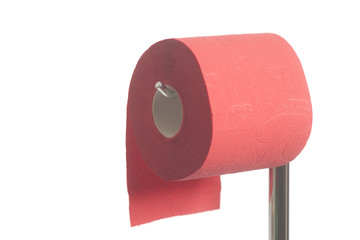 Red roll of soft toilet paper hanging on  modern chrome holder