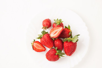 Ripe red strawberry on white table