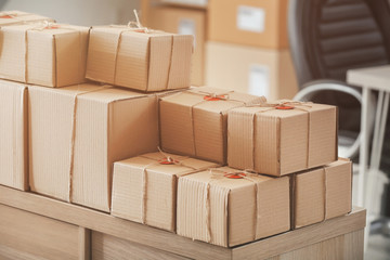 Parcels ready for shipment to client on table in home office