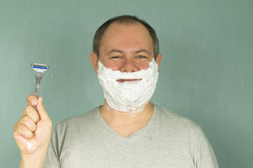 the man is shaving