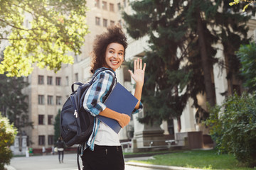 African-american student with books at university