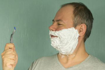 the man is shaving