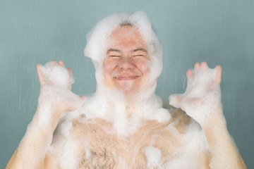 a man in foam is washed