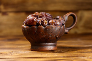 Dried dates fruit on wooden table