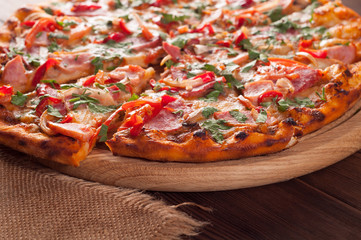 Pizza on a wooden board, close-up