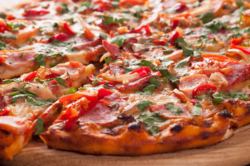 Pizza on a wooden board, close-up