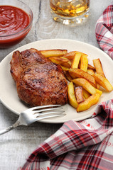 pork steak on dice with potatoes