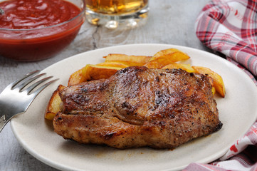 pork steak on dice with potatoes
