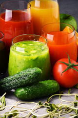 Glasses with fresh organic vegetable and fruit juices