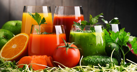 Glasses with fresh organic vegetable and fruit juices