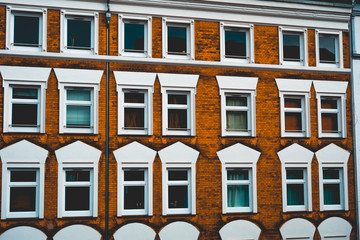 orange brick facade with white ornaments