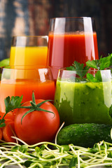 Glasses with fresh organic vegetable and fruit juices