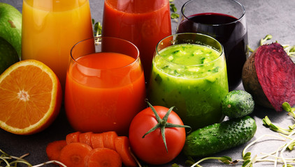 Glasses with fresh organic vegetable and fruit juices