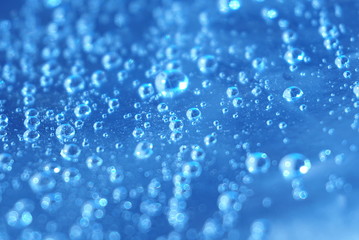 Drops of water on a blue background.
