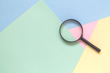 Magnifier on pastel background search minimalistic concept.
