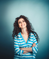 happy curly woman arms crossed smiling