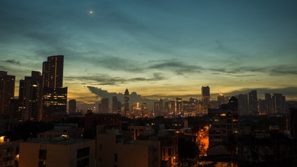 Fototapeta premium Panorama of the City of Manila with skyscrapers early in the morning.