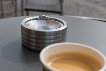 ashtray on a coffee to go table cup