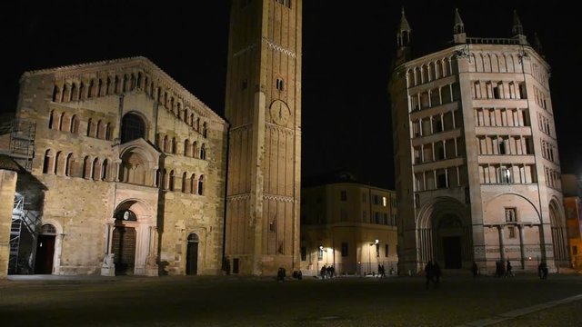 Parma, Italy: People walking in front of Medieval Parma Cathedral