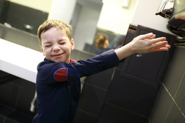 Boy drying his hands