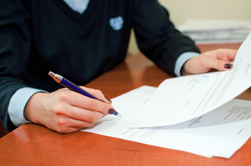 Business woman signing documents