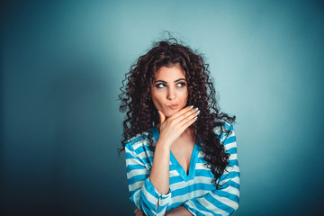 thoughtful woman thinking hand on chin looking to side