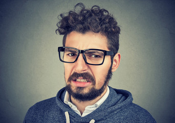 Disgusted male feels aversion towards something