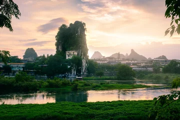 Gordijnen Sunset scene in Guilin, China, with stunning rock formation © creativefamily
