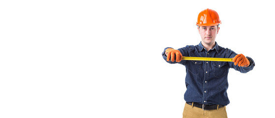 repairman (builder) holds the tape measure in his hand isolated on white background. Copy space