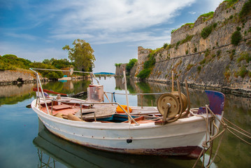 Fototapeta na wymiar A traditional fishing boat near Agia Mavra castle in Lefkada ionian island in Greece