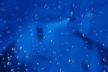 Drops of water on a blue background.