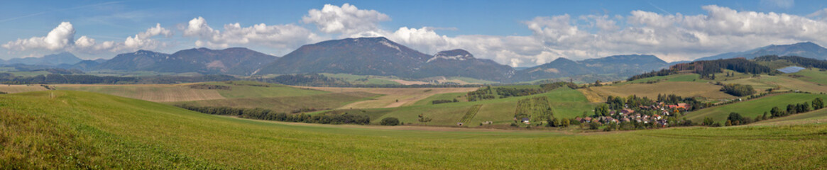 Summer hills panoramic landscape with Benusovce village in Slovakia.