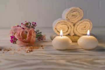 spa concept, white towels, flowers